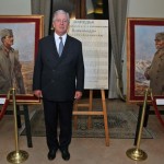 Njegovo Kraljevsko Visočanstvo Prestolonaslednik Aleksandar ispred portreta svog dede, Nj.V. Kralja Aleksandra I i svog pradede Nj.V. Kralja Petra I